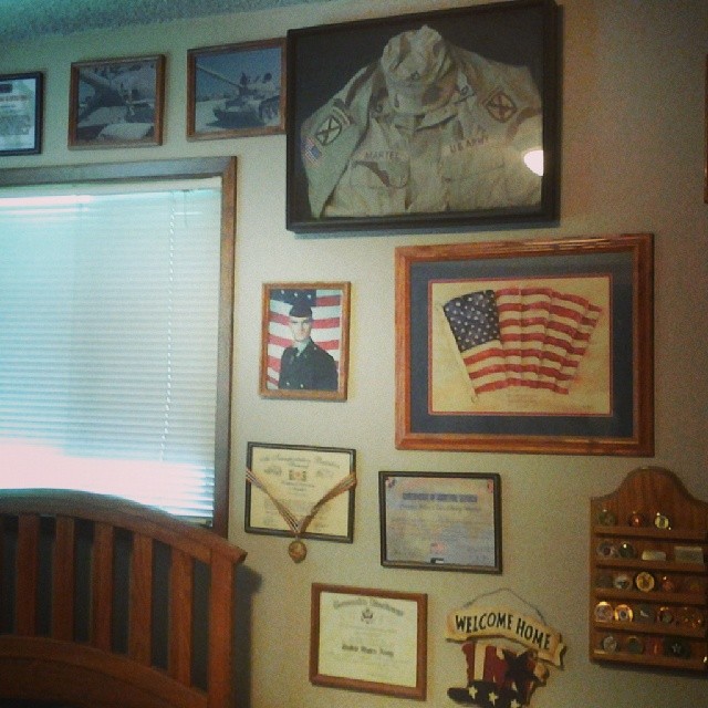 A wall of my various military achievements at my father’s house. Only about three of those campaign coins are mine though.