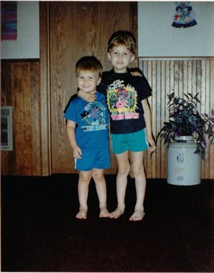 One of the few photos that I have from my early childhood, with my younger brother Curtis and I in the living room of the old house.

